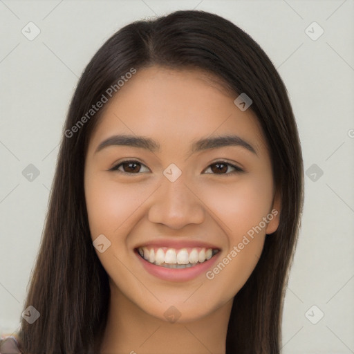 Joyful latino young-adult female with long  brown hair and brown eyes