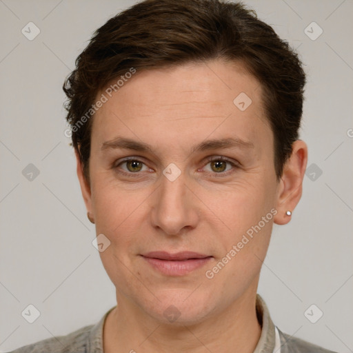 Joyful white adult female with short  brown hair and grey eyes