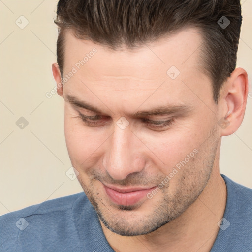 Joyful white adult male with short  brown hair and brown eyes