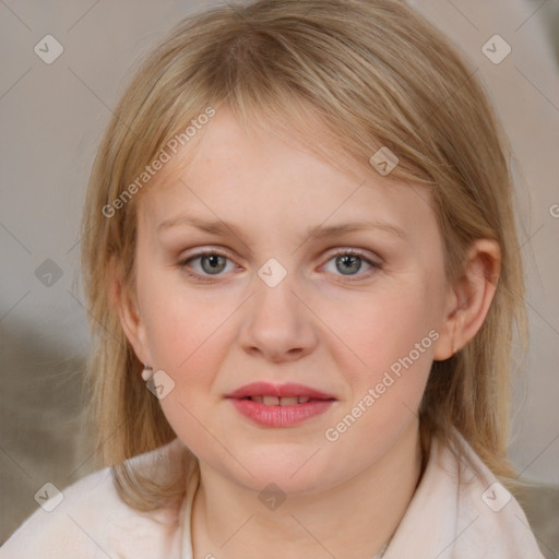 Joyful white young-adult female with medium  brown hair and blue eyes