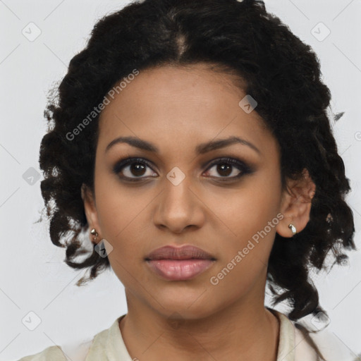 Joyful black young-adult female with medium  brown hair and brown eyes