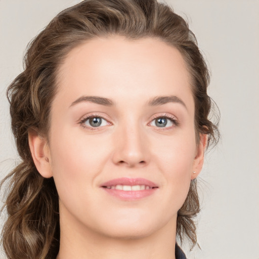 Joyful white young-adult female with medium  brown hair and blue eyes