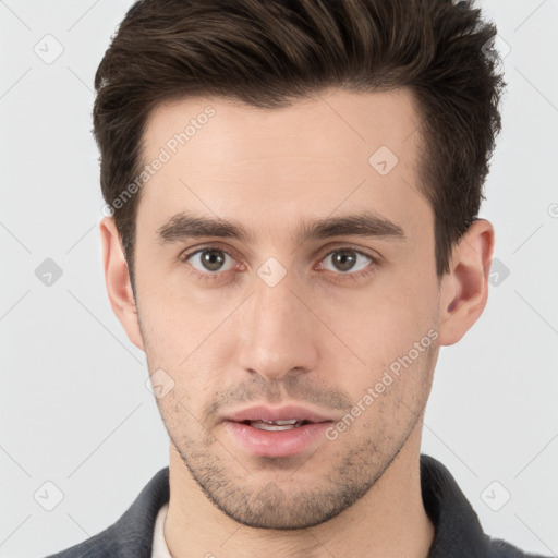 Neutral white young-adult male with short  brown hair and brown eyes