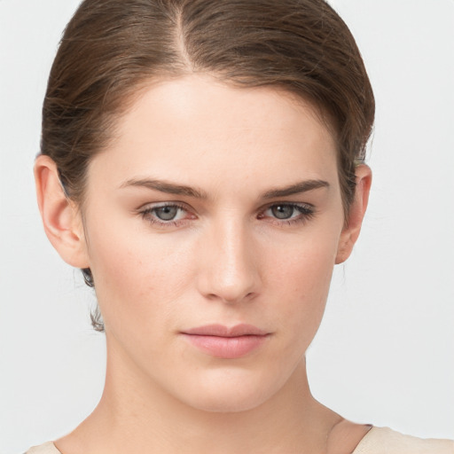 Neutral white young-adult female with short  brown hair and brown eyes