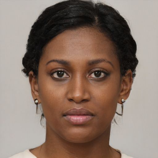 Neutral black young-adult female with short  brown hair and brown eyes