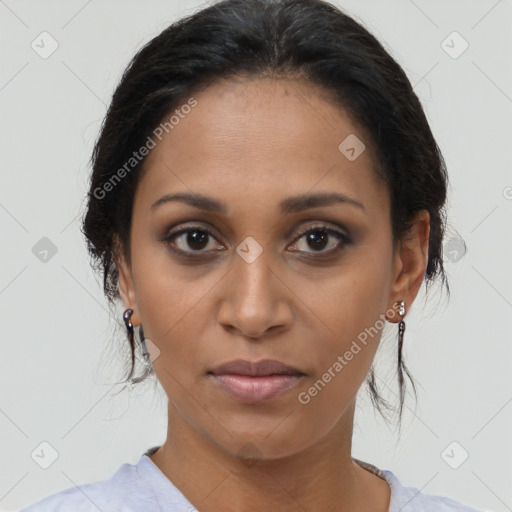 Joyful latino young-adult female with medium  brown hair and brown eyes