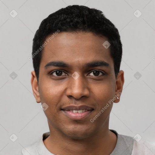 Joyful black young-adult male with short  black hair and brown eyes