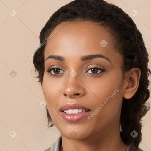 Joyful latino young-adult female with long  brown hair and brown eyes