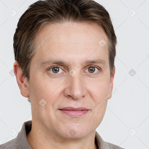 Joyful white adult male with short  brown hair and grey eyes