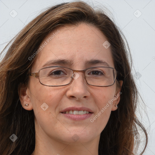 Joyful white adult female with long  brown hair and brown eyes