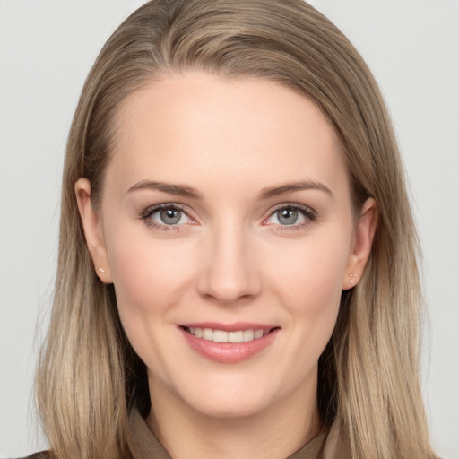 Joyful white young-adult female with long  brown hair and grey eyes