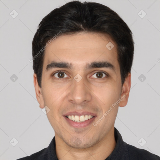 Joyful white young-adult male with short  black hair and brown eyes