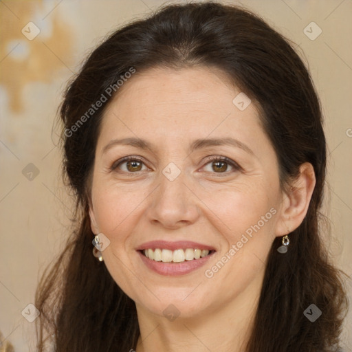 Joyful white adult female with long  brown hair and brown eyes