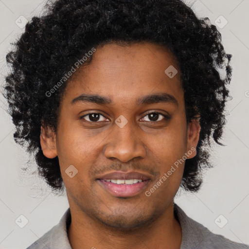 Joyful black young-adult male with short  brown hair and brown eyes