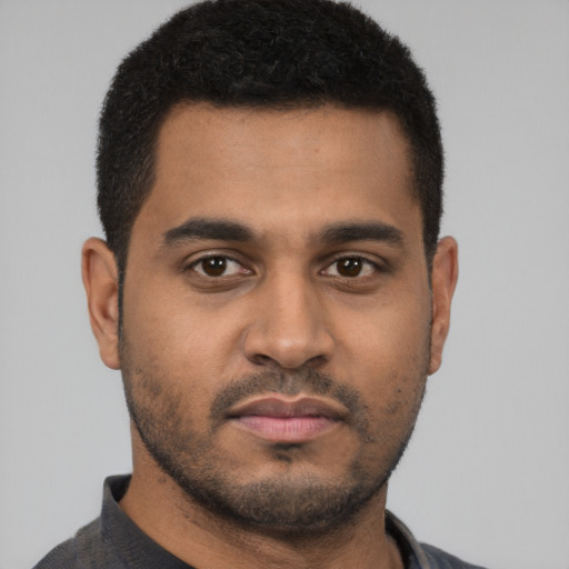 Neutral black young-adult male with short  black hair and brown eyes
