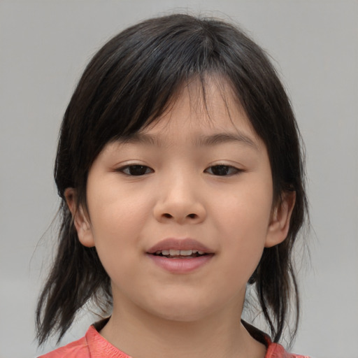 Joyful asian child female with medium  brown hair and brown eyes