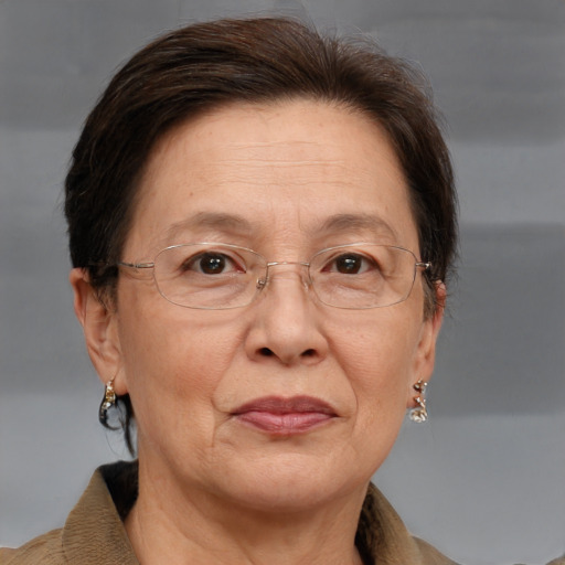 Joyful white middle-aged female with short  brown hair and brown eyes