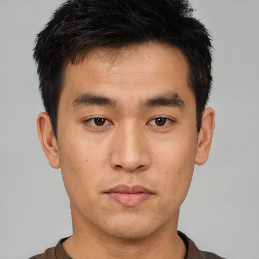 Neutral asian young-adult male with short  brown hair and brown eyes