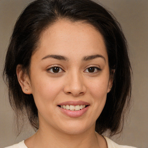 Joyful white young-adult female with medium  brown hair and brown eyes
