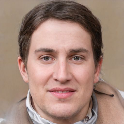 Joyful white adult male with short  brown hair and grey eyes