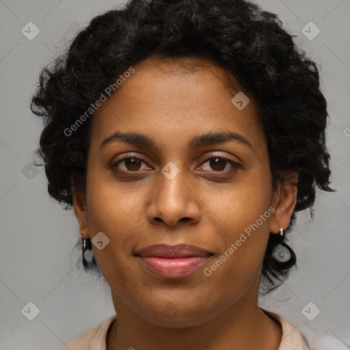 Joyful black young-adult female with medium  brown hair and brown eyes