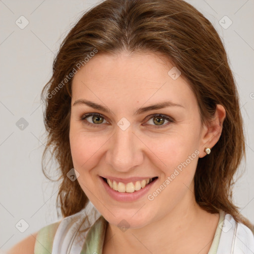 Joyful white young-adult female with medium  brown hair and green eyes