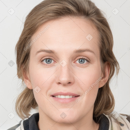 Joyful white young-adult female with medium  brown hair and blue eyes