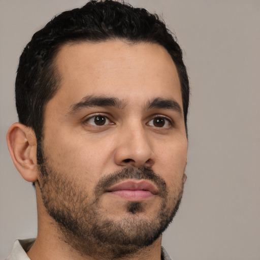 Neutral latino young-adult male with short  black hair and brown eyes