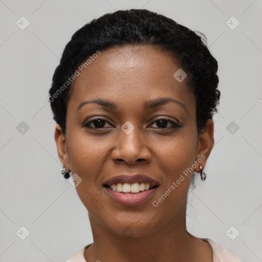 Joyful black young-adult female with short  black hair and brown eyes