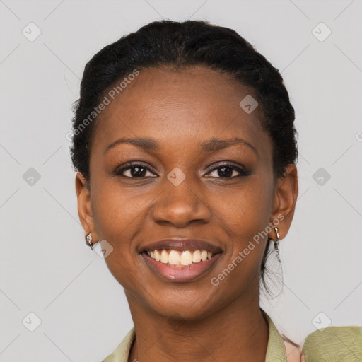 Joyful black young-adult female with short  black hair and brown eyes