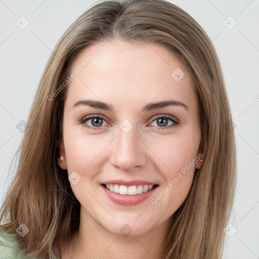 Joyful white young-adult female with long  brown hair and grey eyes