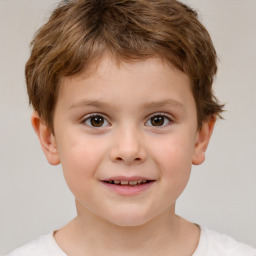 Joyful white child male with short  brown hair and brown eyes