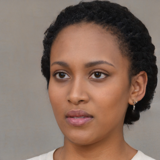 Neutral black young-adult female with short  black hair and brown eyes