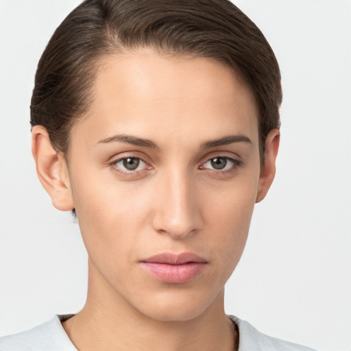 Neutral white young-adult female with short  brown hair and brown eyes