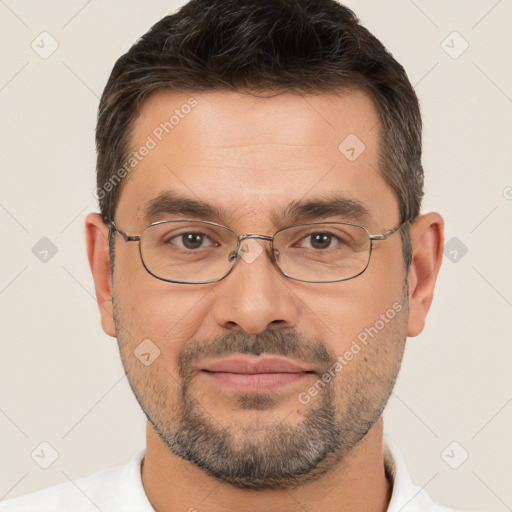 Joyful white adult male with short  brown hair and brown eyes