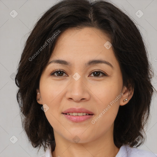 Joyful latino young-adult female with medium  brown hair and brown eyes