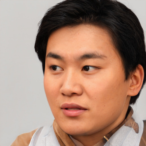 Neutral asian young-adult male with short  brown hair and brown eyes