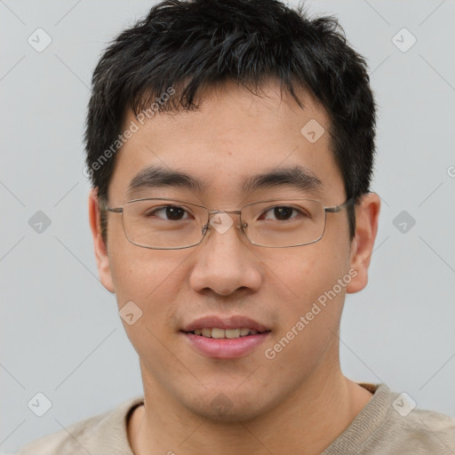 Joyful asian young-adult male with short  brown hair and brown eyes