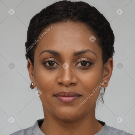 Joyful black young-adult female with short  black hair and brown eyes