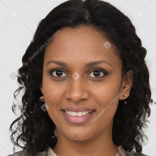 Joyful black young-adult female with long  brown hair and brown eyes