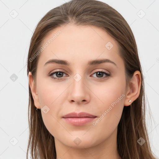 Joyful white young-adult female with long  brown hair and grey eyes