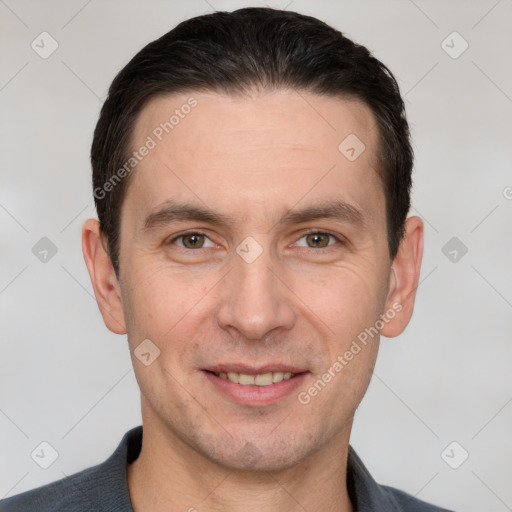 Joyful white adult male with short  brown hair and brown eyes