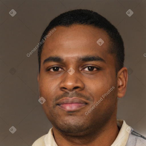 Joyful latino young-adult male with short  brown hair and brown eyes