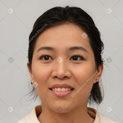 Joyful asian young-adult female with medium  brown hair and brown eyes