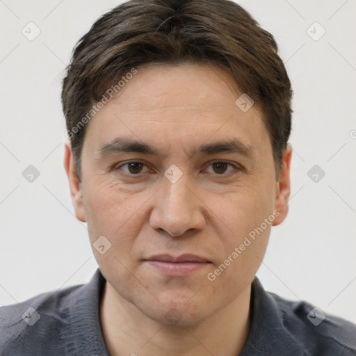 Joyful white adult male with short  brown hair and brown eyes