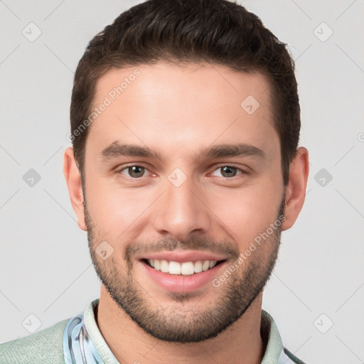 Joyful white young-adult male with short  brown hair and brown eyes