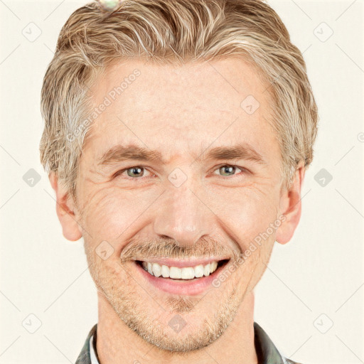 Joyful white adult male with short  brown hair and grey eyes