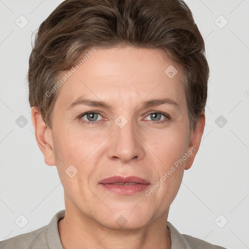 Joyful white adult female with short  brown hair and grey eyes