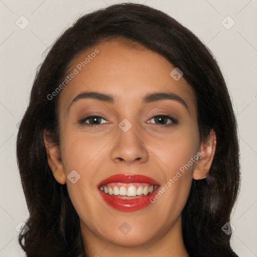 Joyful latino young-adult female with long  brown hair and brown eyes