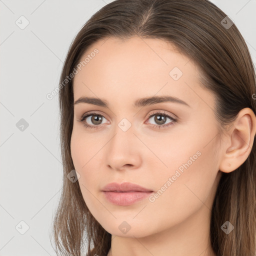 Neutral white young-adult female with long  brown hair and brown eyes